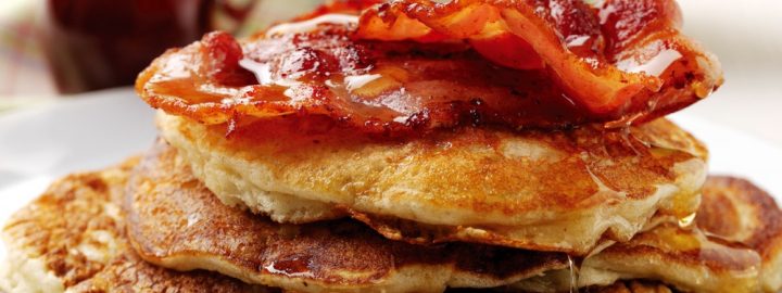 Pancakes with maple syrup and crispy bacon