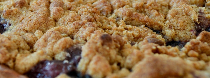 Tarte au fine with plums and crumble topping