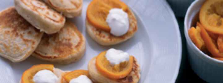 Calorie conscious scotch pancakes with glazed oranges